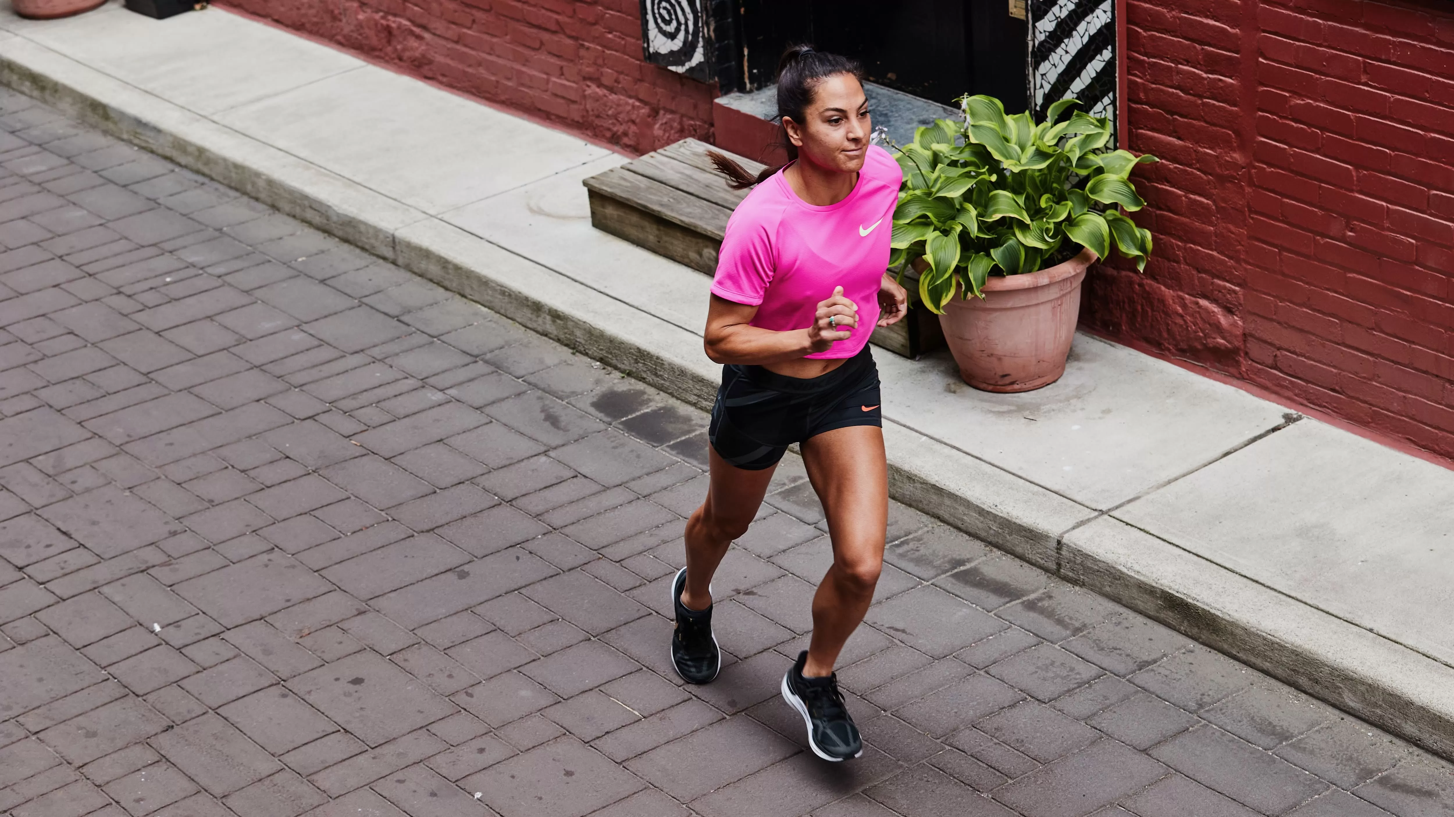female running through urban area